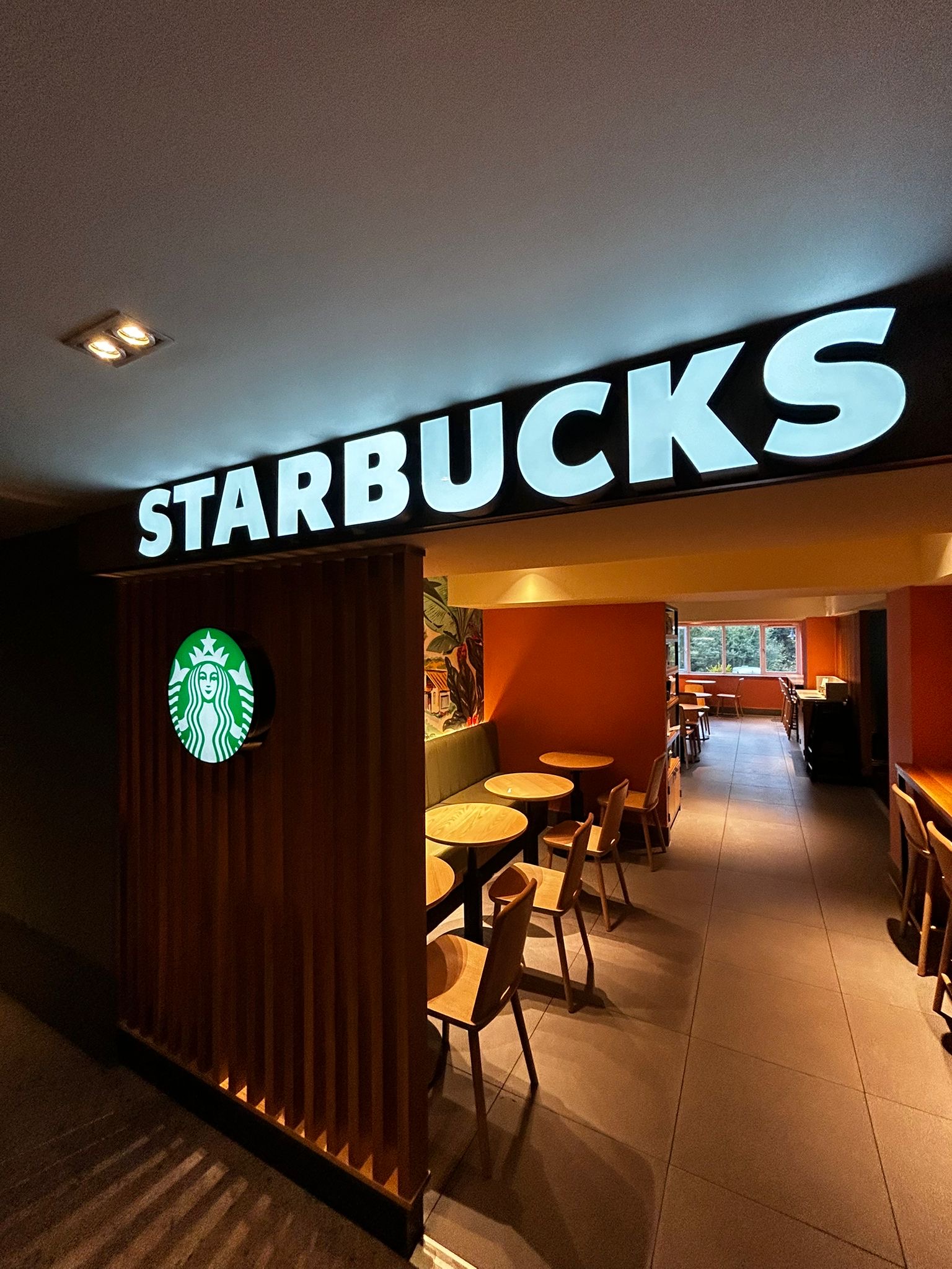 Professional illuminated signage installation — Starbucks channel letters